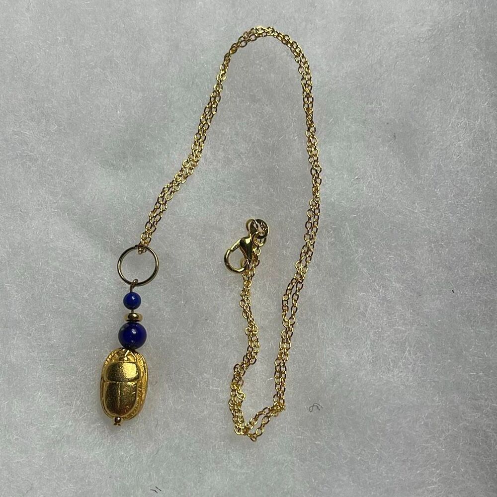 Museum Reproduction Egyptian Revival scarab beetle pendant necklace.